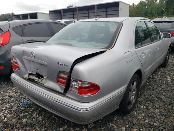 2001 Mercedes-Benz E-Class AWD with VIN WDBJF83J01X047817, listed as a Copart auction lot 71675084 with 143,127 mi miles and Salvage Title. Bid and sale history available at carsss.com. Image 3.