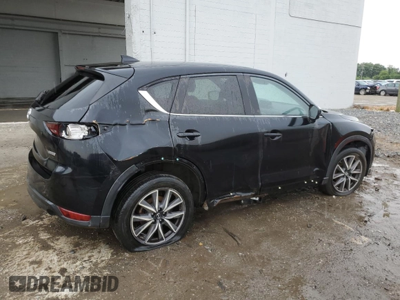 2018 Mazda CX-5 Touring z VIN JM3KFBCM4J0377280, wystawiony jako Copart lot #56688575 z przebiegiem 101 167 mil mil oraz Czysty tytuł • Clean title. Historia ofert i sprzedaży dostępna na DreamBid. Obrazek 3.