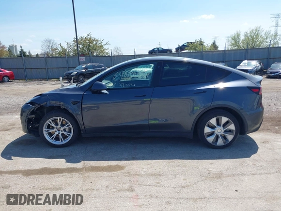 2022 Tesla Model Y Long Range with VIN 7SAYGDEE3NA007737, listed as a IAAI auction lot 42128359 with 42,597 mi miles and . Bid and sale history available at carsss.com. Image 15.