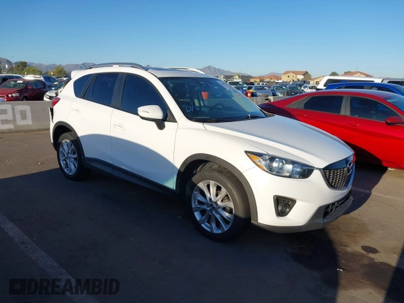 2015 Mazda CX-5 Grand Touring with VIN JM3KE2DYXF0493370, listed as a IAAI auction lot 42087156 with 161,464 mi miles. Bid and sale history available at carsss.com. Image 1.