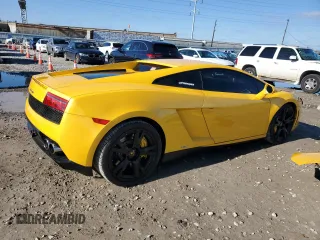 2014 Lamborghini Gallardo z VIN ZHWGU5BZ7ELA13923, wystawiony jako Copart lot #82374714 z przebiegiem 33 260 mil mil oraz Szkoda całkowita • Salvage title. Historia ofert i sprzedaży dostępna na DreamBid. Obrazek 3.