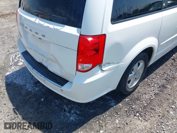 2012 Dodge Grand Caravan SXT with VIN 2C4RDGCG9CR200432, listed as a IAAI auction lot 42027477 with 99,076 mi miles and . Bid and sale history available at DreamBid. Image 6.