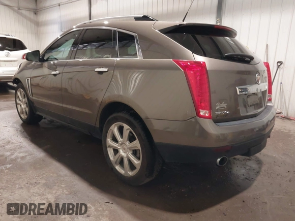 2014 Cadillac SRX Performance Collection z VIN 3GYFNFE38ES578066, wystawiony jako IAAI lot #42153023 z przebiegiem 134 009 mil mil oraz . Historia ofert i sprzedaży dostępna na DreamBid. Obrazek 3.