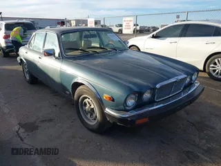 1984 Jaguar XJ with VIN SAJAV1340EC371256, listed as a IAAI auction lot 41253070 with 158,051 mi miles and . Bid and sale history available at DreamBid. Image 1.