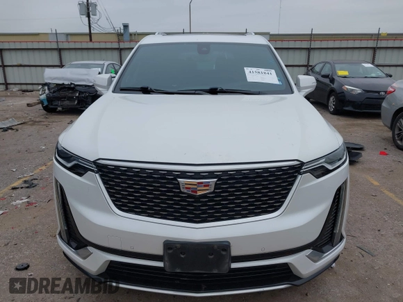 2021 Cadillac XT6 Premium Luxury z VIN 1GYKPCRSXMZ169206, wystawiony jako IAAI lot #41581841 z przebiegiem 64 789 mil mil oraz . Historia ofert i sprzedaży dostępna na DreamBid. Obrazek 6.