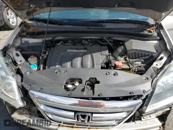 2005 Honda Odyssey Touring z VIN 5FNRL38835B071258, wystawiony jako Copart lot #57878295 z przebiegiem 143 474 mil mil oraz Szkoda całkowita • Salvage title. Historia ofert i sprzedaży dostępna na DreamBid. Obrazek 12.