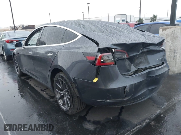 2018 Tesla Model 3 Long Range Battery with VIN 5YJ3E1EB1JF149423, listed as a IAAI auction lot 41896090 with 158,787 mi miles and . Bid and sale history available at DreamBid. Image 3.