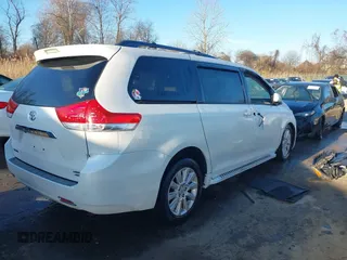2012 Toyota Sienna XLE with VIN 5TDDK3DCXCS032344, listed as a IAAI auction lot 41205400 with 105,274 mi miles. Bid and sale history available at carsss.com. Image 4.