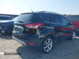 2016 Ford Escape Titanium with VIN 1FMCU0JX5GUC88013, listed as a IAAI auction lot 41933751 with 77,789 mi miles. Bid and sale history available at carsss.com. Image 4.