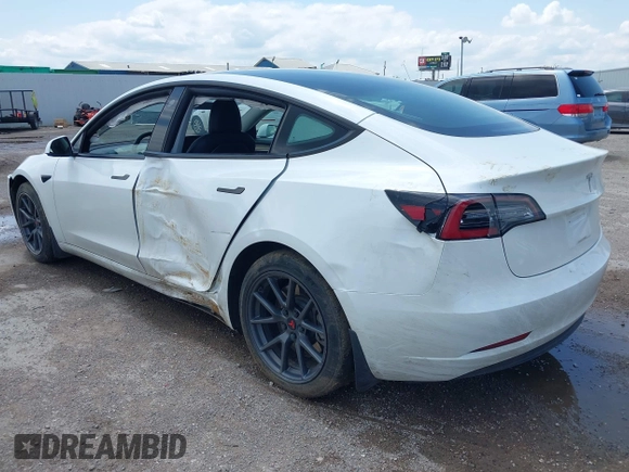 2023 Tesla Model 3 with VIN 5YJ3E1EA5PF407054, listed as a IAAI auction lot 42313770 with 57,621 mi miles and . Bid and sale history available at DreamBid. Image 3.