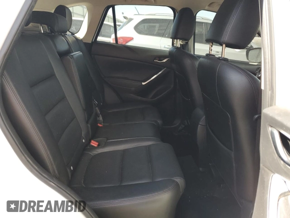 2016 Mazda CX-5 Grand Touring with VIN JM3KE2DY0G0888854, listed as a Copart auction lot 68379754 with 73,096 mi miles and Salvage Title. Bid and sale history available at carsss.com. Image 11.