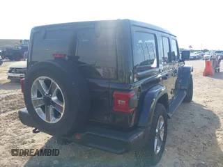 2021 Jeep Wrangler Unlimited Sahara with VIN 1C4HJXEG3MW536507, listed as a IAAI auction lot 41601893 with 51,214 mi miles and . Bid and sale history available at DreamBid. Image 4.