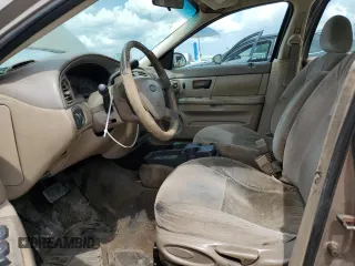 2004 Ford Taurus SE z VIN 1FAFP53U44A122559, wystawiony jako Copart lot #55606595 z przebiegiem Nie podano mil oraz Szkoda całkowita • Salvage title. Historia ofert i sprzedaży dostępna na DreamBid. Obrazek 7.