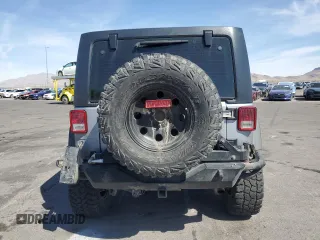 2014 Jeep Wrangler Unlimited Rubicon X with VIN 1C4BJWFG2EL308077, listed as a Copart auction lot 54439265 with 160,746 mi miles and Salvage title. Bid and sale history available at DreamBid. Image 6.
