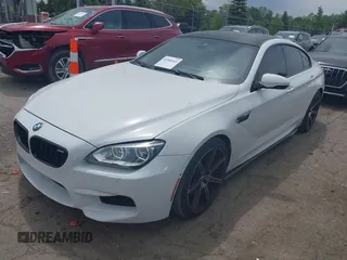 2015 BMW M6 z VIN WBS6C9C50FD467538, wystawiony jako IAAI lot #42366043 z przebiegiem 66 379 mil mil oraz . Historia ofert i sprzedaży dostępna na DreamBid. Obrazek 2.