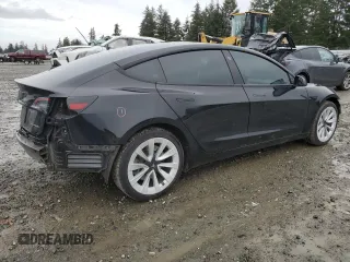 2023 Tesla Model 3 Long Range with VIN 5YJ3E1EB9PF607217, listed as a Copart auction lot 50103645 with 82,198 mi miles and Salvage Title. Bid and sale history available at DreamBid. Image 3.