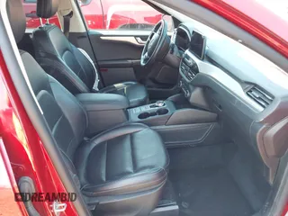 2020 Ford Escape SEL z VIN 1FMCU0H6XLUB62303, wystawiony jako IAAI lot #42646790 z przebiegiem 70 895 mil mil oraz . Historia ofert i sprzedaży dostępna na DreamBid. Obrazek 5.