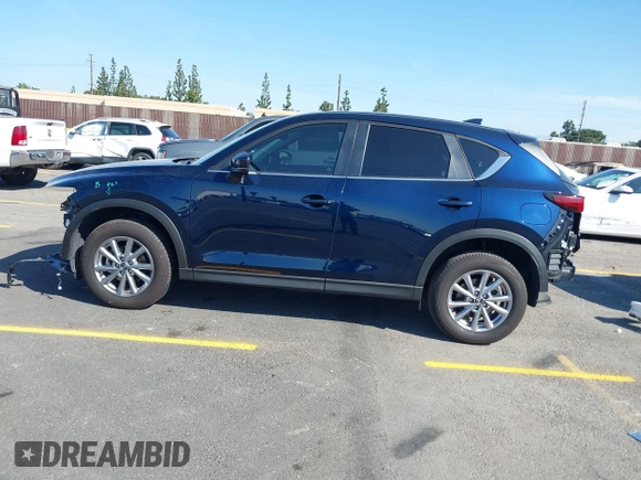 2023 Mazda CX-5 S Carbon Edition z VIN JM3KFBCM7P0197669, wystawiony jako IAAI lot #41992110 z przebiegiem 15 476 mil mil oraz . Historia ofert i sprzedaży dostępna na DreamBid. Obrazek 14.