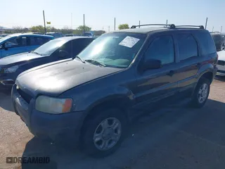 2004 Ford Escape XLT with VIN 1FMCU03134KA96184, listed as a IAAI auction lot 41917091 with 246,067 mi miles. Bid and sale history available at carsss.com. Image 2.