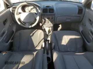 2003 Hyundai Accent GL z VIN KMHCG45C63U413388, wystawiony jako Copart lot #88979235 z przebiegiem 240 928 mil mil oraz Szkoda całkowita • Salvage title. Historia ofert i sprzedaży dostępna na DreamBid. Obrazek 8.