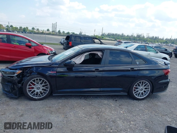 2019 Volkswagen Jetta GLI S with VIN 3VW5T7BU9KM142379, listed as a IAAI auction lot 42056617 with 77,283 mi miles and . Bid and sale history available at DreamBid. Image 14.