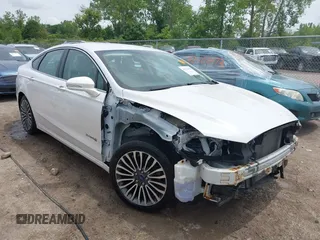 2017 Ford Fusion Hybrid Titanium z VIN 3FA6P0RU2HR388636, wystawiony jako IAAI lot #42516438 z przebiegiem 117 381 mil mil oraz . Historia ofert i sprzedaży dostępna na DreamBid. Obrazek 1.