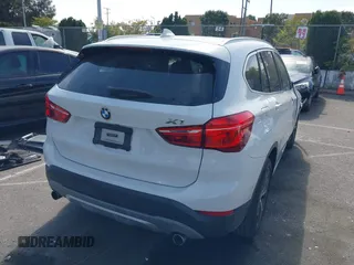 2018 BMW X1 xDrive28i with VIN WBXHT3C37J5K28375, listed as a IAAI auction lot 42039336 with 28,664 mi miles. Bid and sale history available at carsss.com. Image 4.
