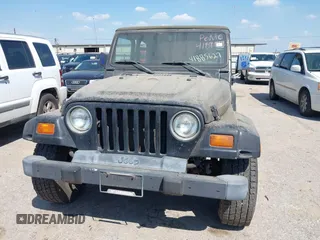 1998 Jeep Wrangler SE with VIN 1J4FY29P1WP806244, listed as a IAAI auction lot 41885627 with 131,486 mi miles. Bid and sale history available at carsss.com. Image 6.