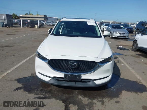 2017 Mazda CX-5 Grand Touring with VIN JM3KFADLXH0222341, listed as a IAAI auction lot 41990464 with 94,374 mi miles and . Bid and sale history available at carsss.com. Image 13.