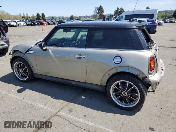 2009 MINI Hardtop S with VIN WMWMF73549TT94143, listed as a Copart auction lot 52120615 with 144,334 mi miles and Salvage Title. Bid and sale history available at DreamBid. Image 2.