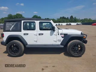 2018 Jeep Wrangler Unlimited Sport S with VIN 1C4HJXDG7JW150038, listed as a IAAI auction lot 42519194 with 113,300 mi miles and . Bid and sale history available at DreamBid. Image 13.