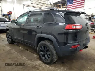 2015 Jeep Cherokee Trailhawk z VIN 1C4PJMBS0FW598694, wystawiony jako Copart lot #60731615 z przebiegiem 130 219 mil mil oraz Czysty tytuł • Clean title. Historia ofert i sprzedaży dostępna na DreamBid. Obrazek 2.