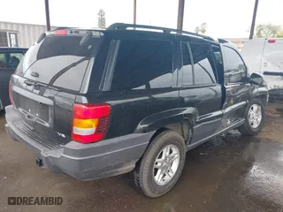 2004 Jeep Grand Cherokee Laredo with VIN 1J4GX48N94C435700, listed as a IAAI auction lot 41809624 with 147,413 mi miles. Bid and sale history available at carsss.com. Image 4.