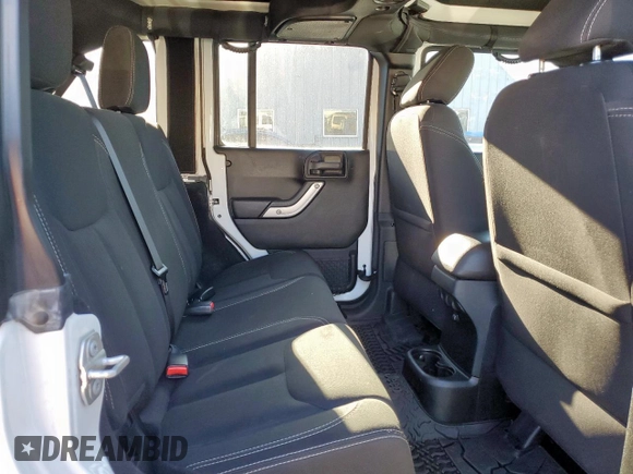 2016 Jeep Wrangler Unlimited Sahara z VIN 1C4HJWEG6GL218719, wystawiony jako Copart lot #56065235 z przebiegiem 96 061 mil mil oraz Szkoda całkowita • Salvage title. Historia ofert i sprzedaży dostępna na DreamBid. Obrazek 11.