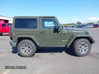 2015 Jeep Wrangler Rubicon Hard Rock with VIN 1C4BJWCGXFL771669, listed as a IAAI auction lot 42057423 with 36,996 mi miles and . Bid and sale history available at DreamBid. Image 14.