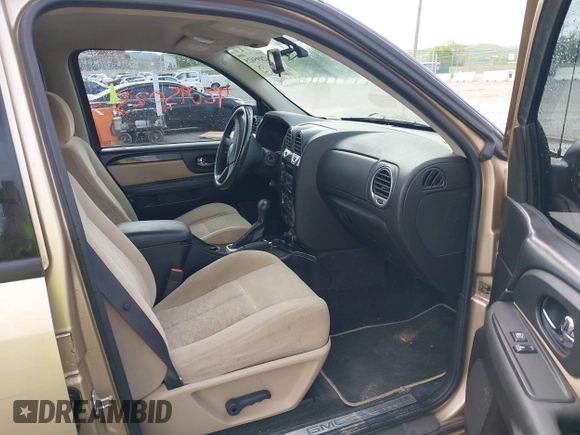 2005 GMC Envoy SLT with VIN 1GKDS13S452141376, listed as a IAAI auction lot 42095025 with 198,911 mi miles and . Bid and sale history available at DreamBid. Image 5.