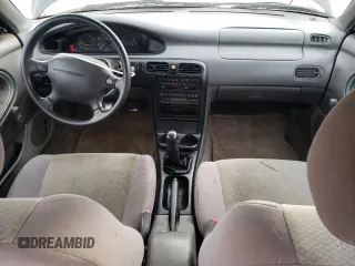 1996 Mazda 626 z VIN 1YVGE22C2T5585359, wystawiony jako Copart lot #74568444 z przebiegiem 159 922 mil mil oraz Szkody całkowita. Historia ofert i sprzedaży dostępna na DreamBid. Obrazek 8.