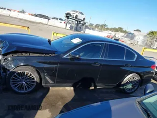 2019 BMW 5 Series 530e with VIN WBAJA9C57KB399541, listed as a IAAI auction lot 41656775 with 96,523 mi miles and . Bid and sale history available at DreamBid. Image 14.