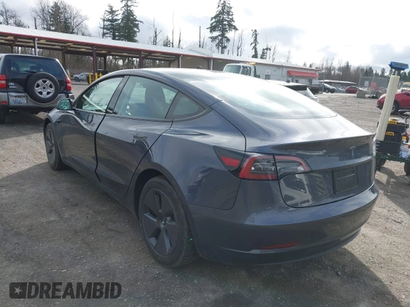 2023 Tesla Model 3 with VIN 5YJ3E1EA2PF623217, listed as a IAAI auction lot 41701413 with 21,246 mi miles and . Bid and sale history available at DreamBid. Image 3.