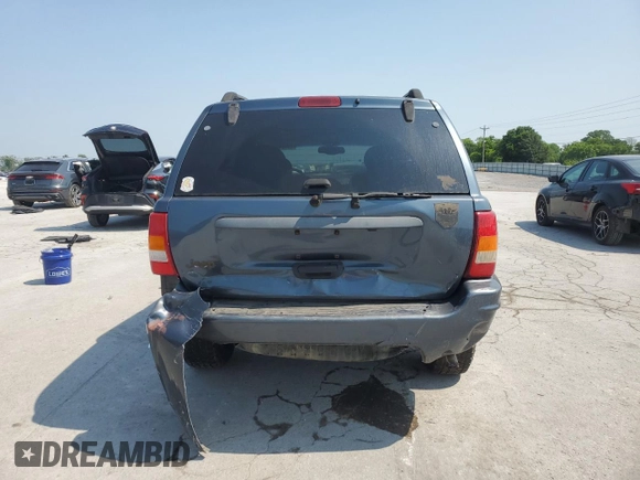 2002 Jeep Grand Cherokee Laredo with VIN 1J4GW48S92C319161, listed as a Copart auction lot 59304035 with 257,907 mi miles and Salvage title. Bid and sale history available at DreamBid. Image 6.