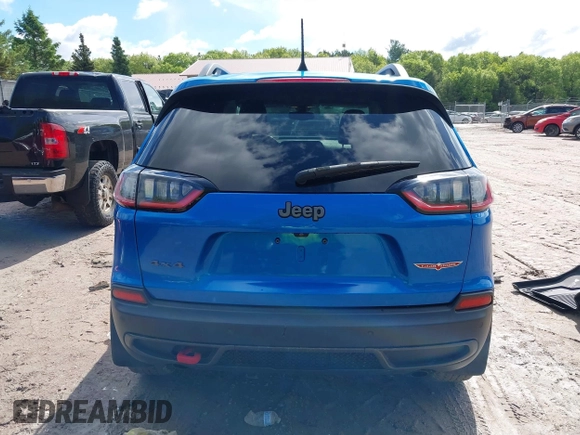 2020 Jeep Cherokee Trailhawk with VIN 1C4PJMBXXLD636547, listed as a IAAI auction lot 42314654 with 59,061 mi miles and . Bid and sale history available at DreamBid. Image 16.