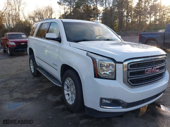 2017 GMC Yukon SLT with VIN 1GKS1BKC5HR214101, listed as a IAAI auction lot 41273942 with 144422 miles. Bid and sale history available at carsss.com. Image 1.