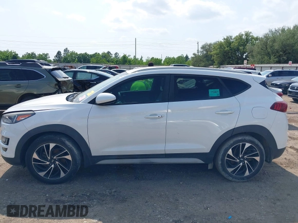 2019 Hyundai Tucson Sport with VIN KM8J33AL1KU861698, listed as a IAAI auction lot 42129173 with 100,160 mi miles. Bid and sale history available at carsss.com. Image 14.