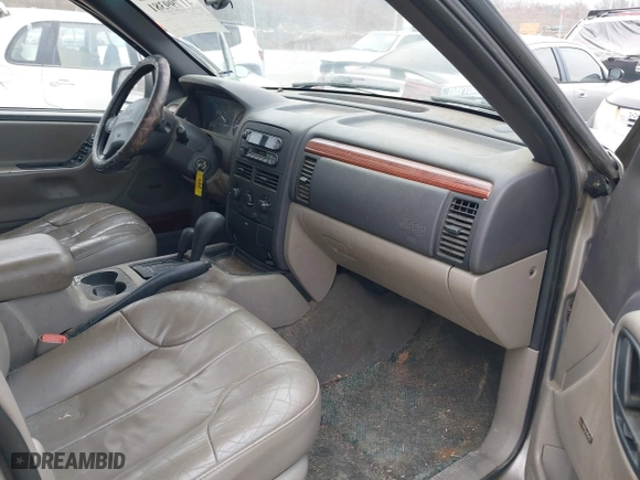 1999 Jeep Grand Cherokee Laredo with VIN 1J4GW58N4XC676836, listed as a IAAI auction lot 41799381 with 203,784 mi miles. Bid and sale history available at carsss.com. Image 5.