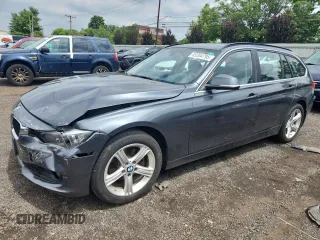 2015 BMW 3 Series 328i xDrive with VIN WBA3G7C52FK480593, listed as a Copart auction lot 63204795 with 125,690 mi miles and Salvage title. Bid and sale history available at DreamBid. Image 1.