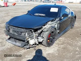 2014 Scion FR-S z VIN JF1ZNAA14E9708590, wystawiony jako IAAI lot #41278089 z przebiegiem 117 357 mil mil oraz . Historia ofert i sprzedaży dostępna na DreamBid. Obrazek 6.