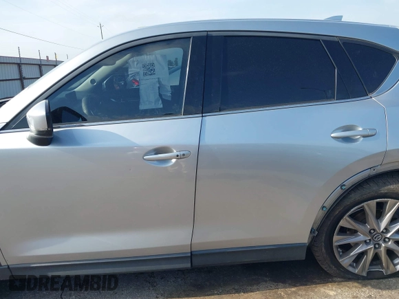 2020 Mazda CX-5 Grand Touring with VIN JM3KFADM5L0739306, listed as a IAAI auction lot 42215667 with 126,100 mi miles and . Bid and sale history available at DreamBid. Image 14.