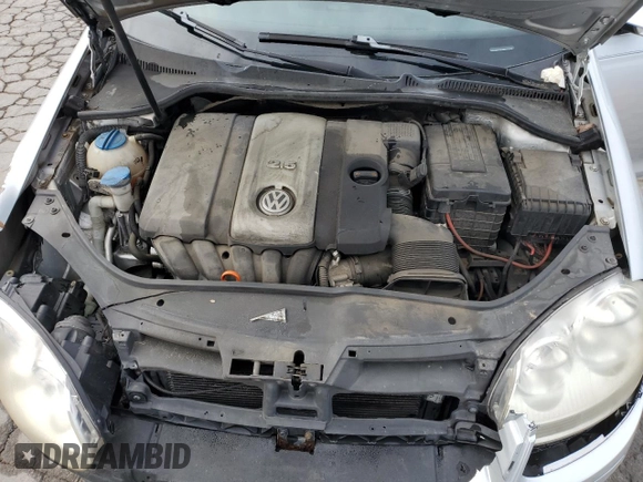 2008 Volkswagen Jetta S z VIN 3VWHM71K18M167909, wystawiony jako Copart lot #53254605 z przebiegiem 138 440 mil mil oraz Szkoda całkowita • Salvage title. Historia ofert i sprzedaży dostępna na DreamBid. Obrazek 11.