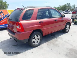 2009 Kia Sportage LX with VIN KNDJE723897599966, listed as a IAAI auction lot 42107627 with 118,512 mi miles. Bid and sale history available at carsss.com. Image 4.
