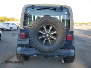 2001 Jeep Wrangler Sport with VIN 1J4FA49S21P346900, listed as a Copart auction lot 75439604 with 128,824 mi miles and Clean Title. Bid and sale history available at carsss.com. Image 6.